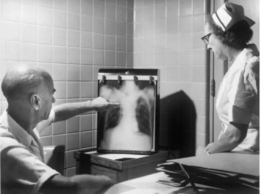 Two people looking at an x-ray
